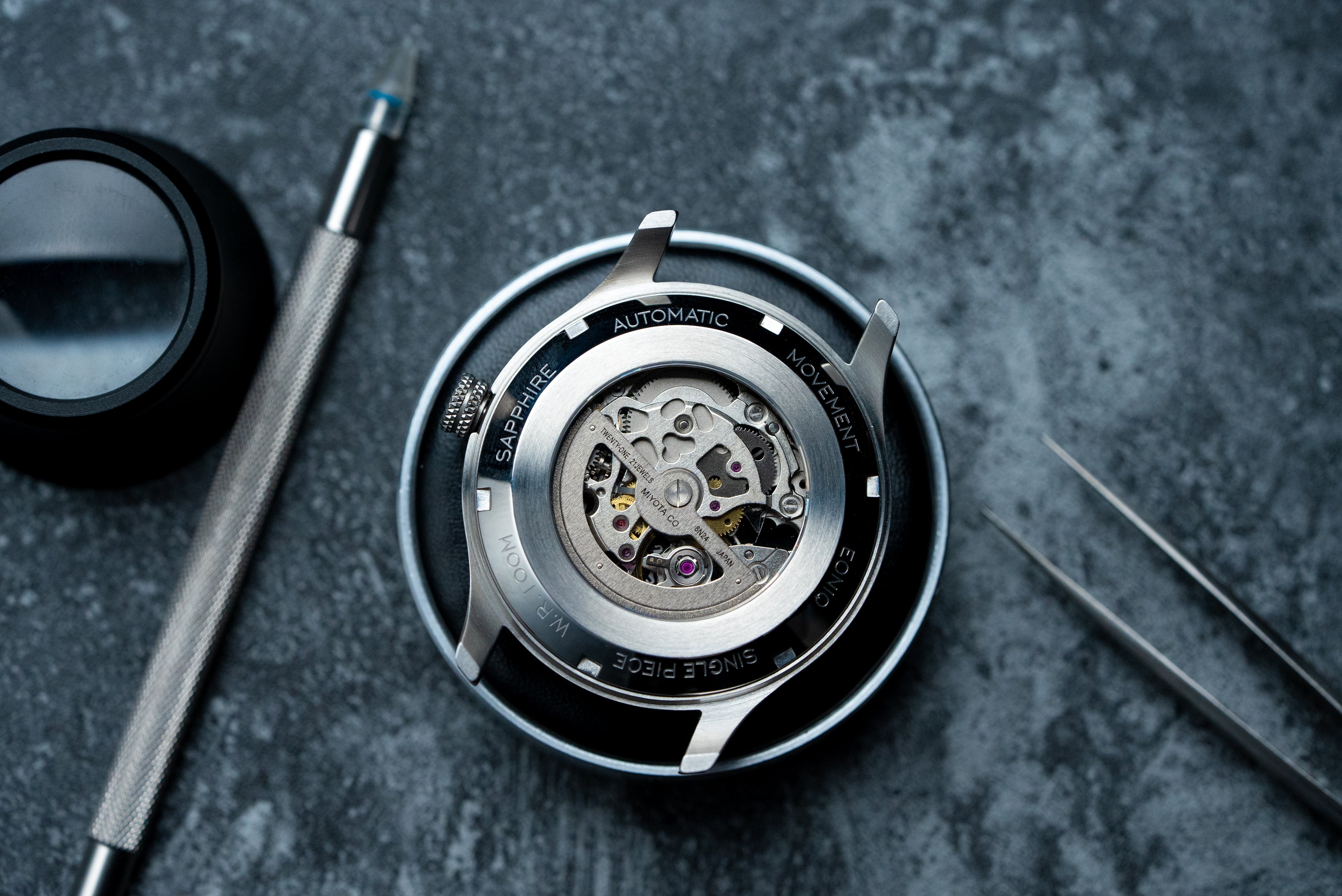 Sapphire exhibition case back of EONIQ custom watch with Miyota 8N24 movement. Other movements available.