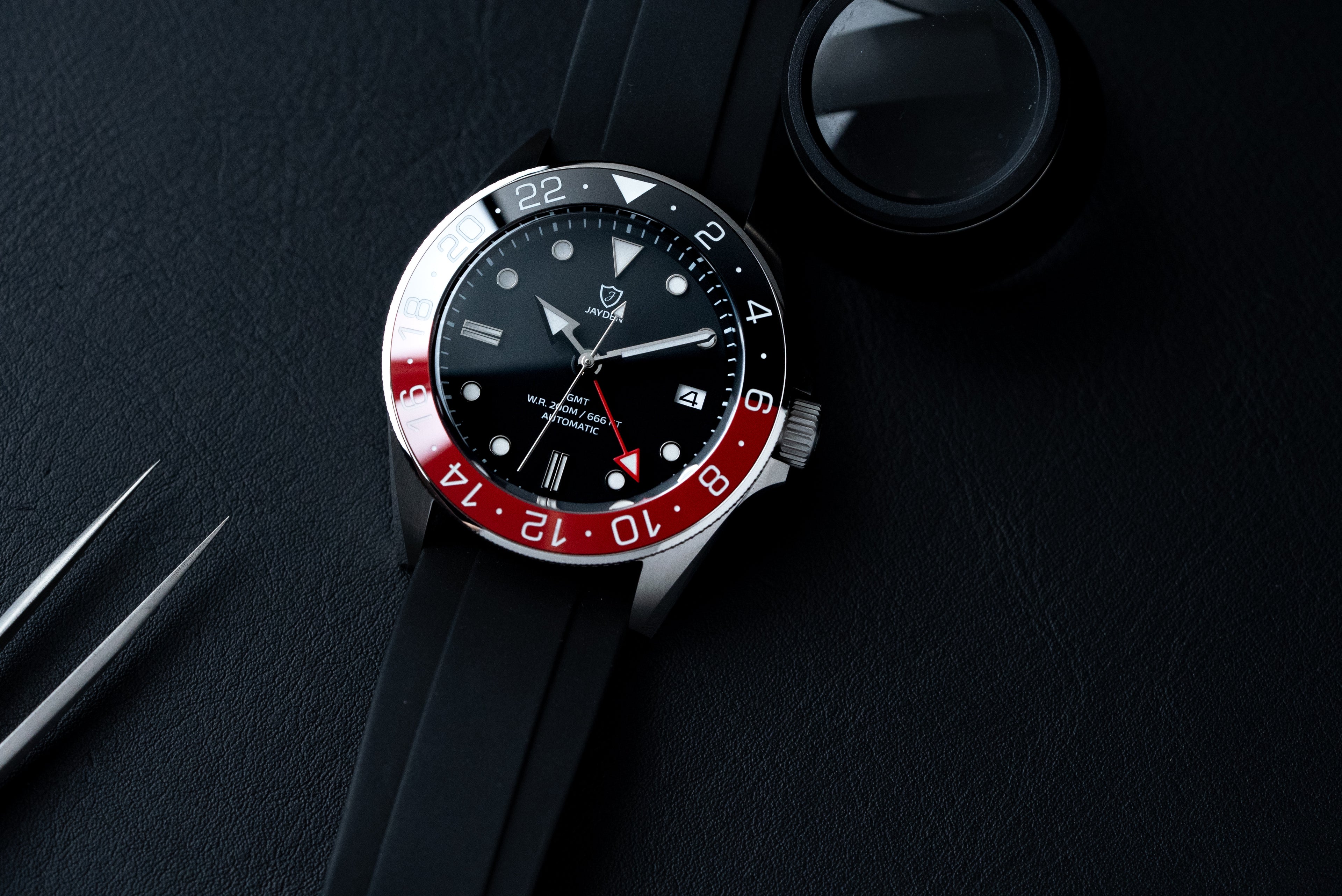 Custom made GMT diver by EONIQ, paired with FKM straps. Black-Red ceramic insert with BGW9 superlume.  Red 24 hour hands for the 2nd time zone display. Powered by TMI NH34