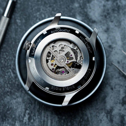 EONIQ - Custom Skeleton watch case back with silver miyota 8N24 movement